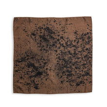 A square brown bandana or scarf featuring a black ink-blot style pattern, displayed flat against a solid white background.